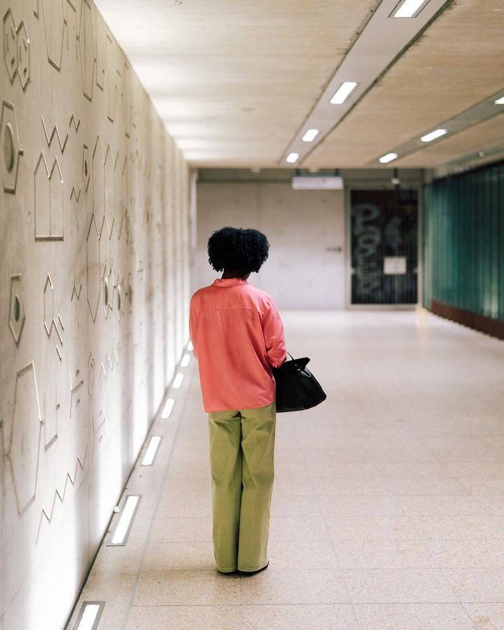 Figure in a graphic corridor