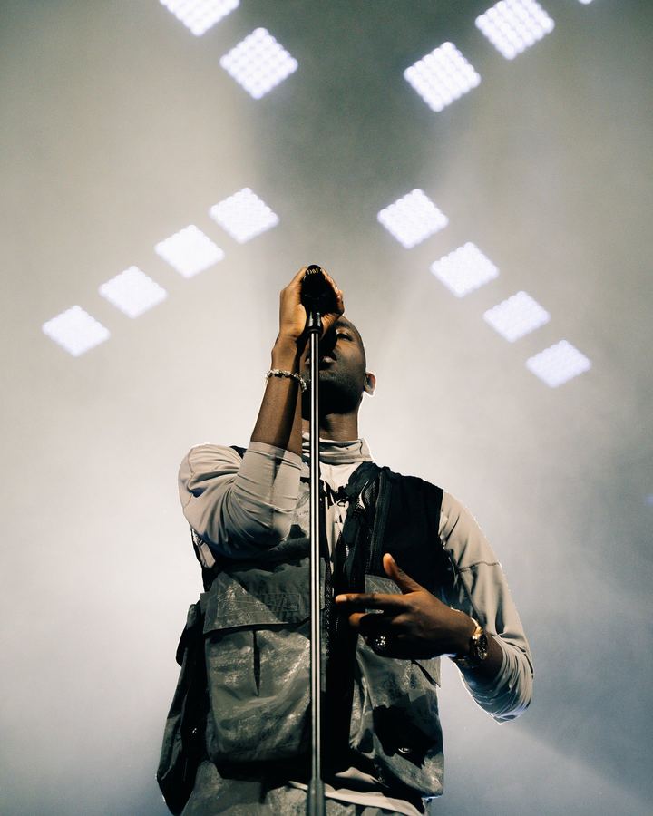 Artist under stage lights